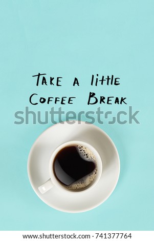 Top view of cup of black coffee and Take a little coffee break lettering isolated on blue background