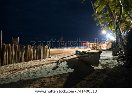 Beautiful view of the beach at night. Boat on the beach in Philippines