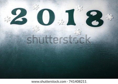 Christmas and New Year Background Green colour
 Wooden Figures 2018 Holiday Symbol Snow Top View Copy space for Text 