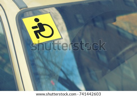 on the windshield of the car the sign is invalid