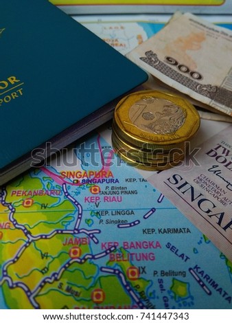 Photo Illustration of Budget Calculating for journey from Indonesia to Singapore.   