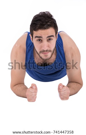 Handsome muscular athlete man  doing push-ups and wearing sport's wear, against white background