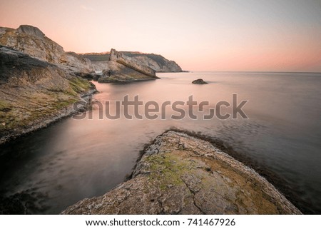 Seascape With Rocks In The Foreground