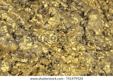 the texture of the background of gold money bars