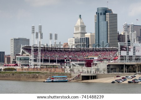 Downtown view of Cincinnati during baseball game across Ohio River.