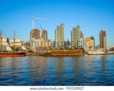 Sailing yacht near san diego bay seeing beautiful view of san diego downtown in the evening of beautiful summer day with clear blue sky. Riding boat and see San Diego downtown background.
