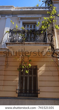 Photo of famous and picturesque neoclassical houses in Anafiotika district, Plaka, Athens historic center, Attica, Greece                         