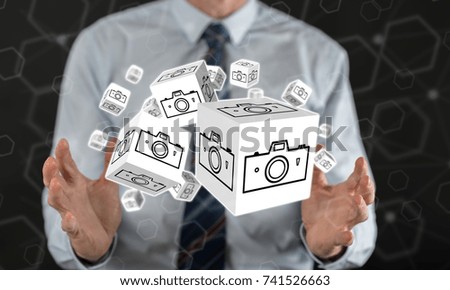 Pictures sharing concept between hands of a man in background