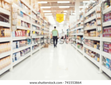 Supermarket or retail store blur background. That is a self-service shop offer grocery and variety of food, beverage and household product on shelf or rack. For product display, shopping background.