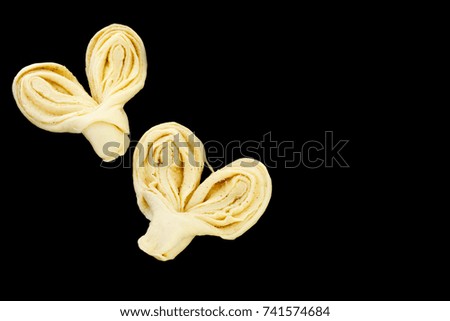 Buns with sugar. Cooking process. Black background