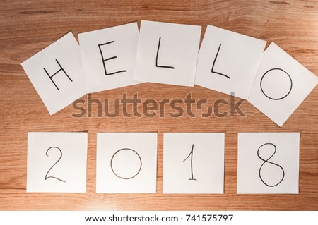 on a wooden background, hello 2018