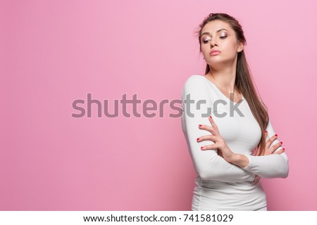 The young woman's portrait with proud and arrogant emotions Royalty-Free Stock Photo #741581029