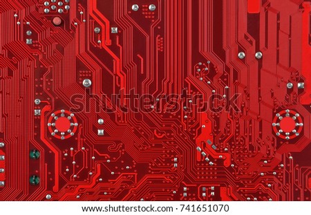 Close up of printed red computer circuit board Royalty-Free Stock Photo #741651070