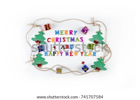 "Merry Christmas and Happy New Year" written with small, colorful, wooden letters on the pure white background