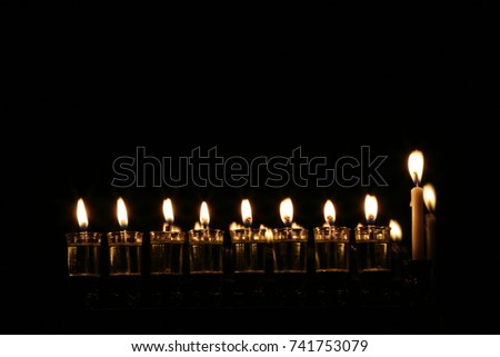 Ignition Chanukah candles for Hanukkah.