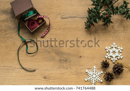 Still life of a variety of fall, Thanksgiving and Christmas Items, arranged on rustic wooden board 
