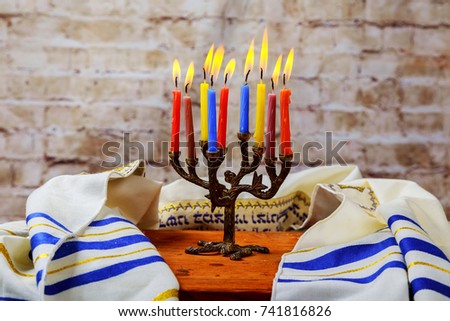 Hanuka menorah with burning candles. Jewish holiday hannukah challah bread