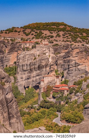 Beautiful aerial panoramic photo of the monasteries and rock formations of Meteora above Kalampaka city in Thessaly, Greece, Europe.
