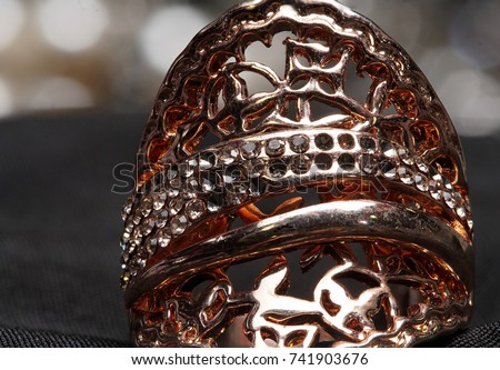 High Value Gems Stone accessories, Gold, copper, Diamond ring on holder. Studio lighting black bokeh background, HDR stacking macro photo