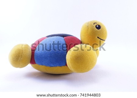 Tortoise doll on a white background.