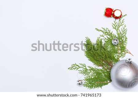 Christmas composition. Christmas gift, pine cones, fir branches on wooden white background. Flat lay, top view