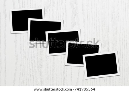 Blank photos on white plank