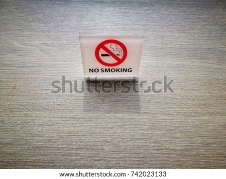 No smoking sign on wood table