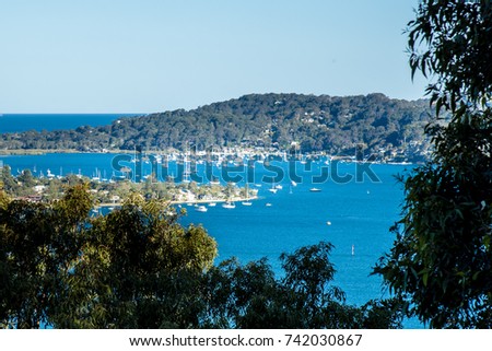 Panoramic daytime view from West Head Lookout to Pittwater, Australia.Scenic ocean panorama, sailing boats and yachts in Sydney Northern Beaches. Royalty-Free Stock Photo #742030867