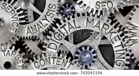 Macro photo of tooth wheel mechanism with DIGITAL MARKETING, CONTENT, ANALYSIS, WWW, SEO, SERVICE and TARGET words imprinted on metal surface