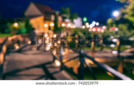 Blur image of walkway and terrace in garden in night time for background usage . (vintage tone)