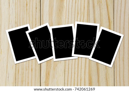 Photo frame blank on wood background with space