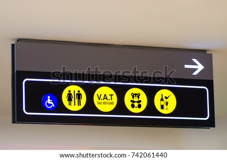 VAT Refund, place for children sign, toilets disabled symbol in airport, modern building. Copy space