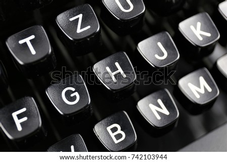 An Image of a vintage typewriter keyboard