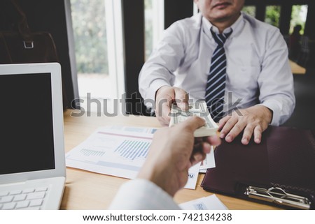 business team working on negotiation to money return on investment from business 
