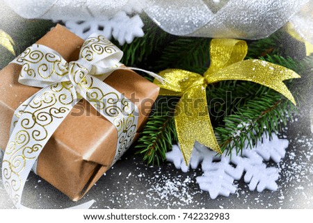 Happy New Year and Merry Christmas. Christmas boxes with gifts with fir on a black background.