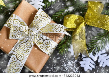 Happy New Year and Merry Christmas. Christmas boxes with gifts with fir on a black background.