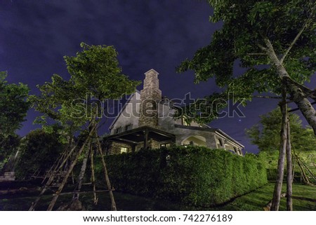 an english house at night with starry sky