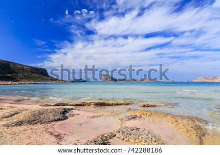 Greece, Crete, Balos Bay, Gramvousa, Cape Tigani, clear water, white and pink sands, a lagoon, the confluence of the Libyan, Ionian and Aegean seas. Royalty-Free Stock Photo #742288186