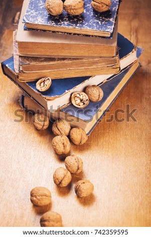 some dry walnuts on old retro book in studio
