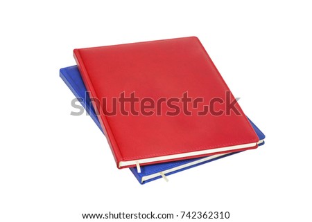 Two pieces red and blue colour leather daily planners isolated on white background. 