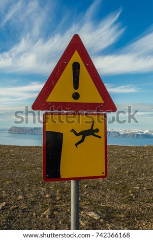 Warning sign - risk of falling down the cliffs