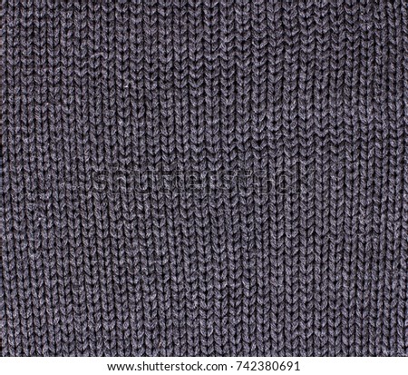 Winter Sweater Design.  Grey knitting wool texture background. knitted fabric texture. Knitted jersey background with a relief pattern. Braids in knitting