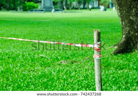 warning tape for safety zone, red and white tape closed garden area