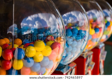 A couple of  gumball machines in a row Royalty-Free Stock Photo #742465897
