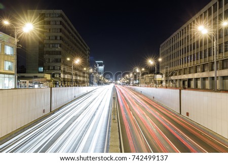 View of transport metropolis, traffic and blurry lights of cars on multi-lane highways and road junction at night in Moscow