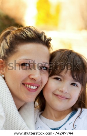 Mother and daughter in a park spending time together for mother's day