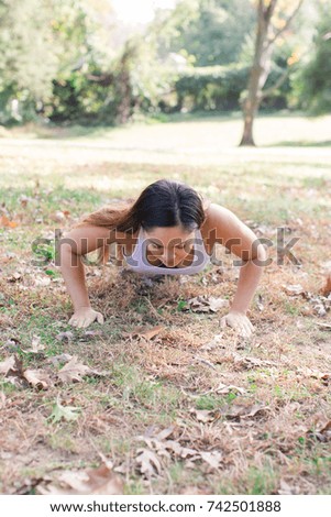 Fitness woman doing push ups