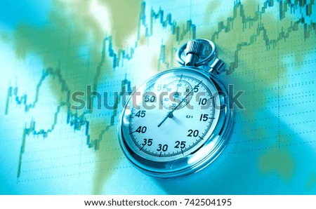 Candlestick chart graphic and stopwatch on map