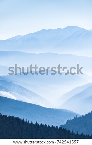 Landscape with blue mountains Royalty-Free Stock Photo #742541557