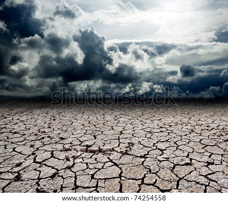 landscape with storm clouds and dry soil